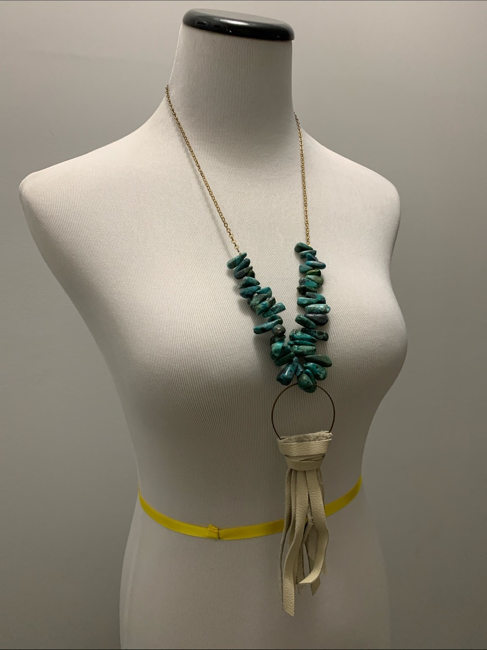 Stone necklace with faux leather tassel